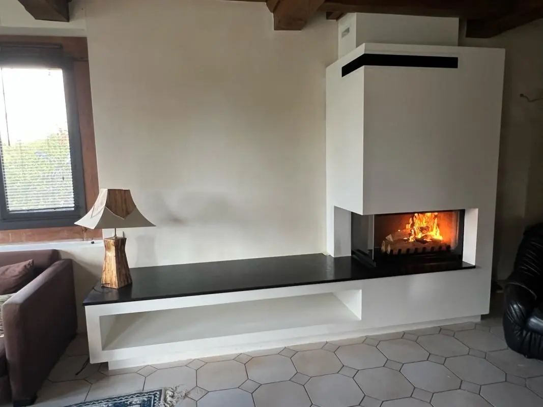 Installation d'une cheminée Jotul Latéral 800 à Breteville sur Odon 