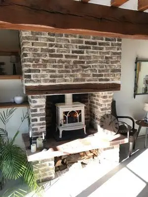 Pose d'un poêle à bois Jotul dans le pays d'Auge